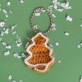 Handmade crochet gingerbread Christmas tree ornament in orange with a red hanging string - Christmas Tree