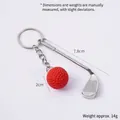 Mini metal golf club and red ball keychain pendant showing product dimensions and 14g weight - Red Golf Ball + Club