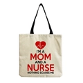 Close-up of durable canvas tote bag featuring nurse heart print and emotional slogan - Mom and Nurse Dual Identity Style (hm6965)