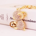 Golden zodiac sheep keychain with crystal ball and sparkling rhinestones on a book - Individual Packaging / White