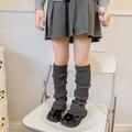 Dark grey knitted leg warmers for girls styled with black shoes and school skirt - One Size / Dark Gray