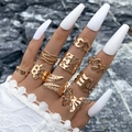 Golden butterfly heart and leaf ring set on long white nails with dark rock backdrop - Butterfly Heart Gold Set (25353-ring-G-EP)