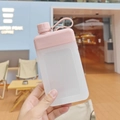 Pink and white square plastic water bottle with matte texture and portable handle - 450ml / Pink