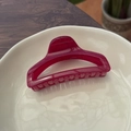 Detailed view of large dark red translucent butterfly perfume bottle hair claw clip - Rose Pink