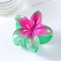 Detail view of a 7cm gradient plumeria hair claw clip with glossy resin flower petals - Green Rose 7cm