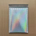 Holographic magenta laser bubble mailer with adhesive seal on corrugated background - 23*29+4cm / Holographic Rainbow