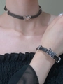 Detail showing black cord necklace and bracelet with silver butterfly pendants on model - Butterfly Leather Choker and Bracelet Set
