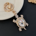 Portachiavi tartaruga dorata con grande cristallo e strass colorati sulla conchiglia - Bianco