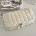 Close-up of cream quilted pencil case with vertical stitching and double zipper design - Milk Yellow