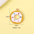 Golden donut charm with yellow enamel coating and colorful sprinkles for DIY jewelry - Donut