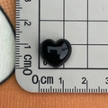 Macro shot of 1cm black heart resin charm on ruler showing miniature size details - Black Heart Small