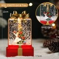 Rote LED-Weihnachtsgeschenkbox-Laterne mit Baum- und Mädchenminiatur und goldener Schleife - Mädchen und Baum Stil / 12x7.5cm
