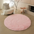 Soft pink round shaggy rug with long plush pile on wooden floor in minimalist living room - Tender Pink