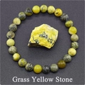 Detail view of 8mm yellow stone beaded elastic bracelet with a matching raw gemstone piece - Grass Yellow Stone