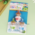Three colorful bear birthday candles with party hats and cupcake bases in clear packaging - Blue Green Cake Bear Candle