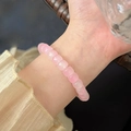 Elegant pink beaded crystal bracelet on wrist with translucent natural stone finish - Translucent Pink Beaded (MY37861)