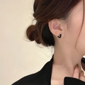 Elegant heart-shaped black enamel stud earrings with gold plating on a model - [XKE0045] Black Shell Heart Studs Gold