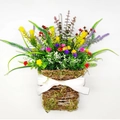 Colorful artificial wildflowers and greenery in a rustic woven basket with white bow - Texas Wildflower Basket