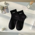Calze nere in cotone con ricamo SMILE da donna, stile sportivo e design minimalista - Taglia unica / Nero