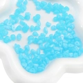 Irregular blue acrylic smudge beads in a white floral ceramic bowl for DIY jewelry - Lake Blue