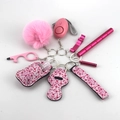 Pink personal safety keychain set with alarm window breaker and pompom accessory - 18-Pink Protective Gear