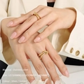 Golden stainless steel knot ring for women available in US sizes five to seven - US5 / Braided Knot Style Ring / Gold