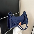 Minimalist navy blue patent leather baguette bag with knotted strap and gold hardware - Blue