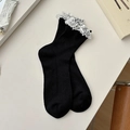 Women's black crew socks featuring double-layer white lace cuffs and a small bow detail - One Size / Black Slouchy Tube
