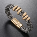 Close-up of woven leather bracelet with gold magnetic clasp and diamond-encrusted accents - Retro Mixed Grey & Gold
