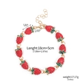 Golden bracelet featuring red enamel strawberry charms with lobster clasp details - B00189-01 Red Strawberry Enamel Bracelet