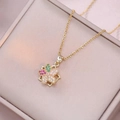Detailed close-up of a golden rotating flower pendant necklace with colorful zircons - X2181 Colorful Rotating