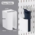 White wall-mounted shaver holder for pegboard with dimensions and usage display - Razor Holder - White