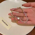 Close-up of colorful beaded bracelet with gold chain and white star pendant detail - 1# Bracelet-Colorful