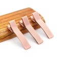 Set of three pink fabric-wrapped ribbon duckbill hair clips on a wooden base - 5CM Ribbon Wrapped Clip / Flesh Pink