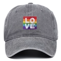 Detailed close-up of LOVE rainbow embroidery on a grey washed cotton baseball cap - One Size / Gray