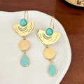 Gold geometric earrings with turquoise enamel on white ceramic plate with wood background - Green Waterdrop Geometric Drop Earrings (DEK524)