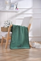 Close-up of deep green microfiber pet towel with black paw prints on a wooden chair - Dark Green