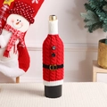 Christmas Santa knit wine bottle cover with belt decor on a festive holiday table - Santa Claus / Red