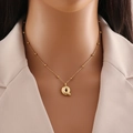 Golden stainless steel necklace featuring a bold 3D letter Q pendant and beaded chain - Letter Q