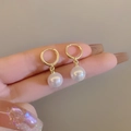 Elegant French-style gold hoop earrings with luminous white pearls for a classic look - Gold