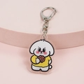 Cute white puppy acrylic keychain with yellow shirt and cookie on pink display stand - Dog with Cookie