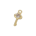 Detail shot of a polished gold key pendant featuring a micro-inset sparkling zircon gem - Gold Key