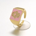 Macro shot of gold Hamsa ring featuring pink enamel and crystal hand on rectangular face - Adjustable Open / Pink