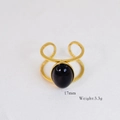Detail of vintage 14k gold plated ring with large black oval gemstone and 17mm size label - Black Large Oval Gemstone Style