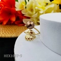 Detail of gold monstera leaf ring with brown pearl on white display stand - Bronze Coffee Pearl Style (HEX1037-9)