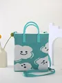 Detail of mint green knitted tote bag with white cloud and blue smiley face patterns - Emerald {Cloud}