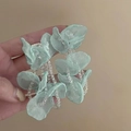 Close-up of mint green tulle flower earring with clear crystal beaded tassels - Mint Green Flower Accessory Style