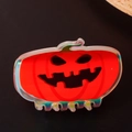 Holographic Halloween pumpkin hair claw clip with orange finish on dark background - Large Iridescent Pumpkin Classic Smile
