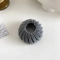 Detail of grey velvet bird nest hair clip showing soft flocked texture and flexible design - Flocked Grey Blue