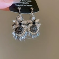 Macro detail of 925 silver satin drop earrings with glittering crystals and tassels - 27# Silver Needle - Grey